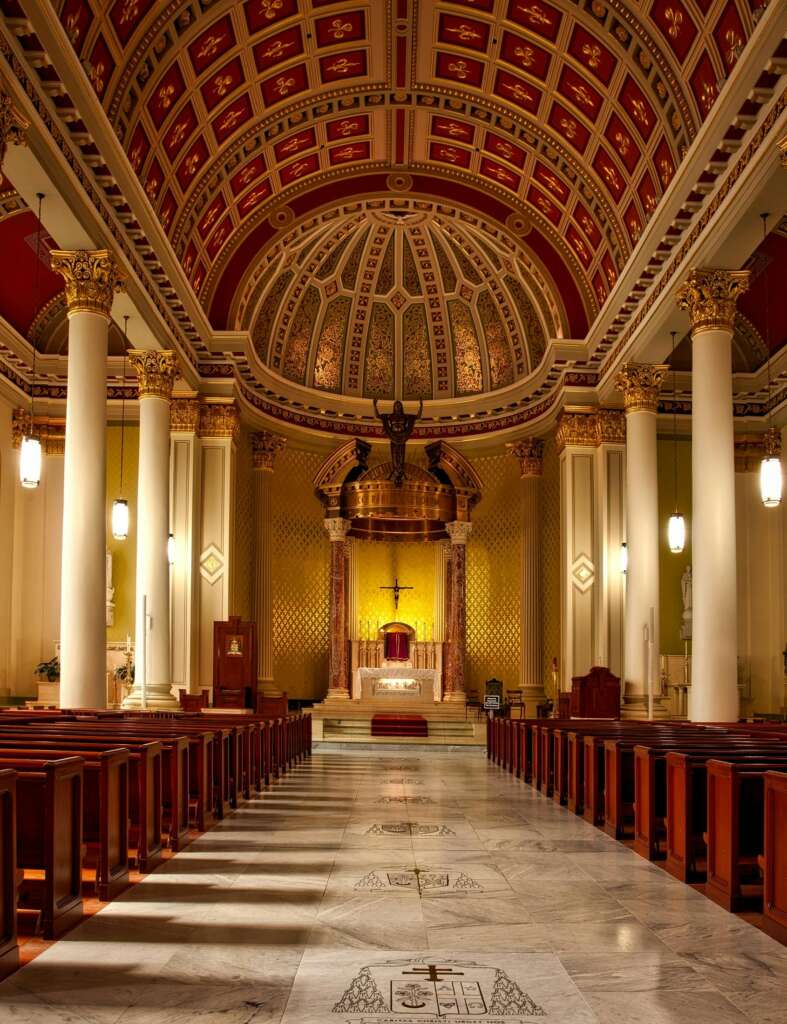 Captivating view of a splendid cathedral interior featuring ornate architecture and vibrant stained glass.